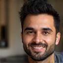 Headshot of Amir Almasi, a barista at Zaman Coffee House.
